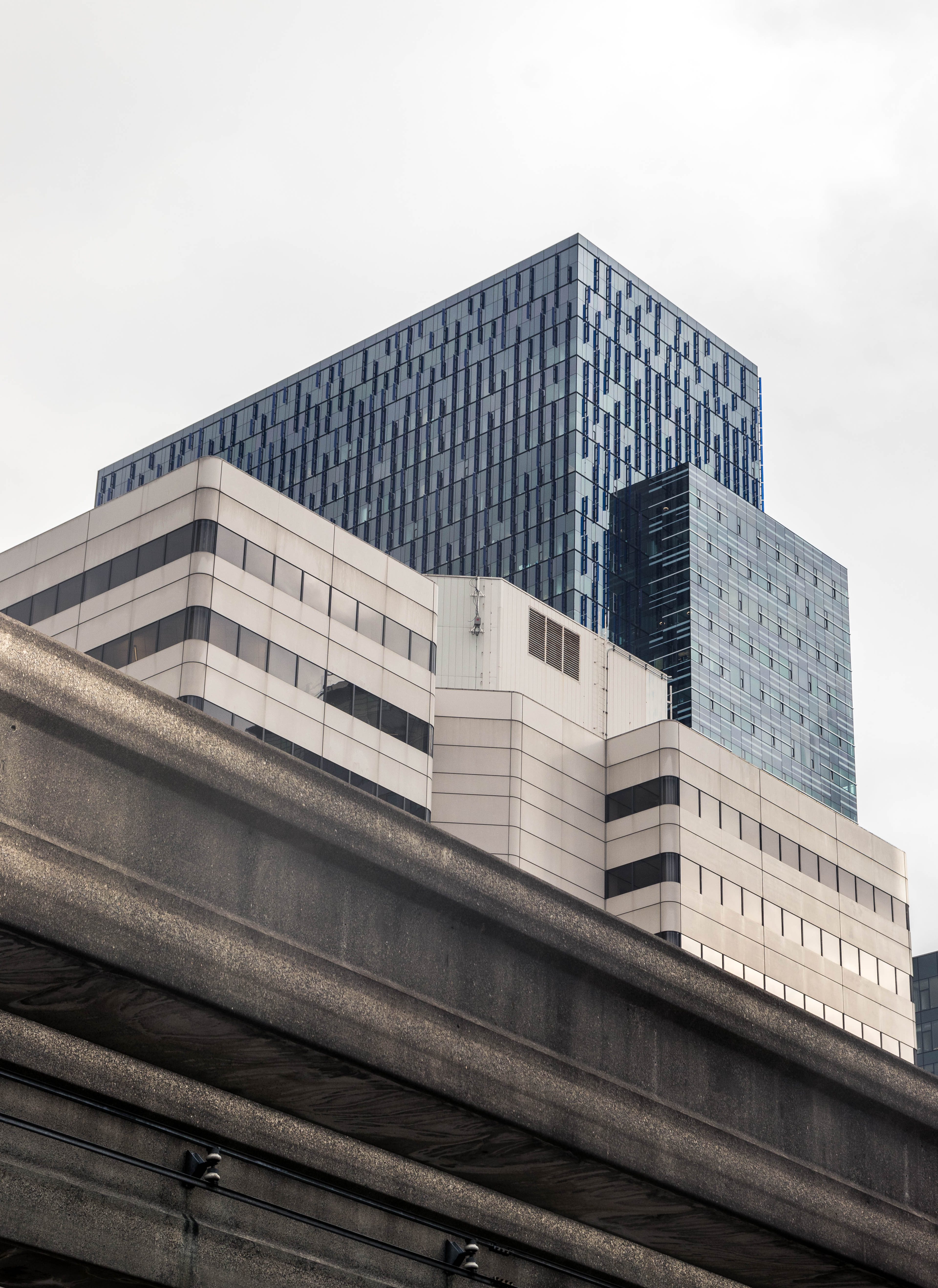 Angular dark glass tower against the sky
