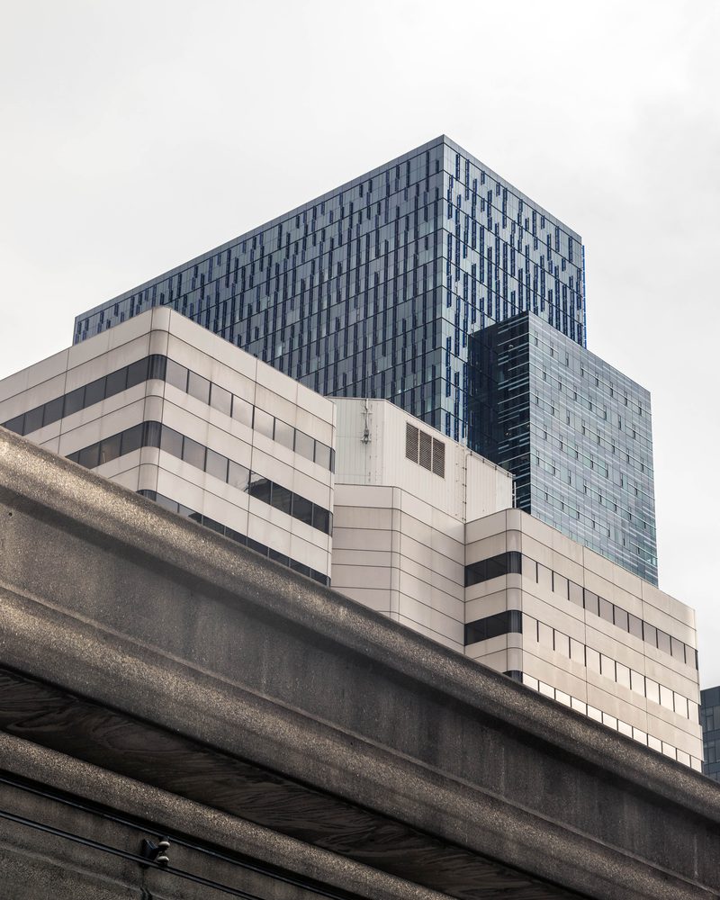 Angular dark glass tower against the sky